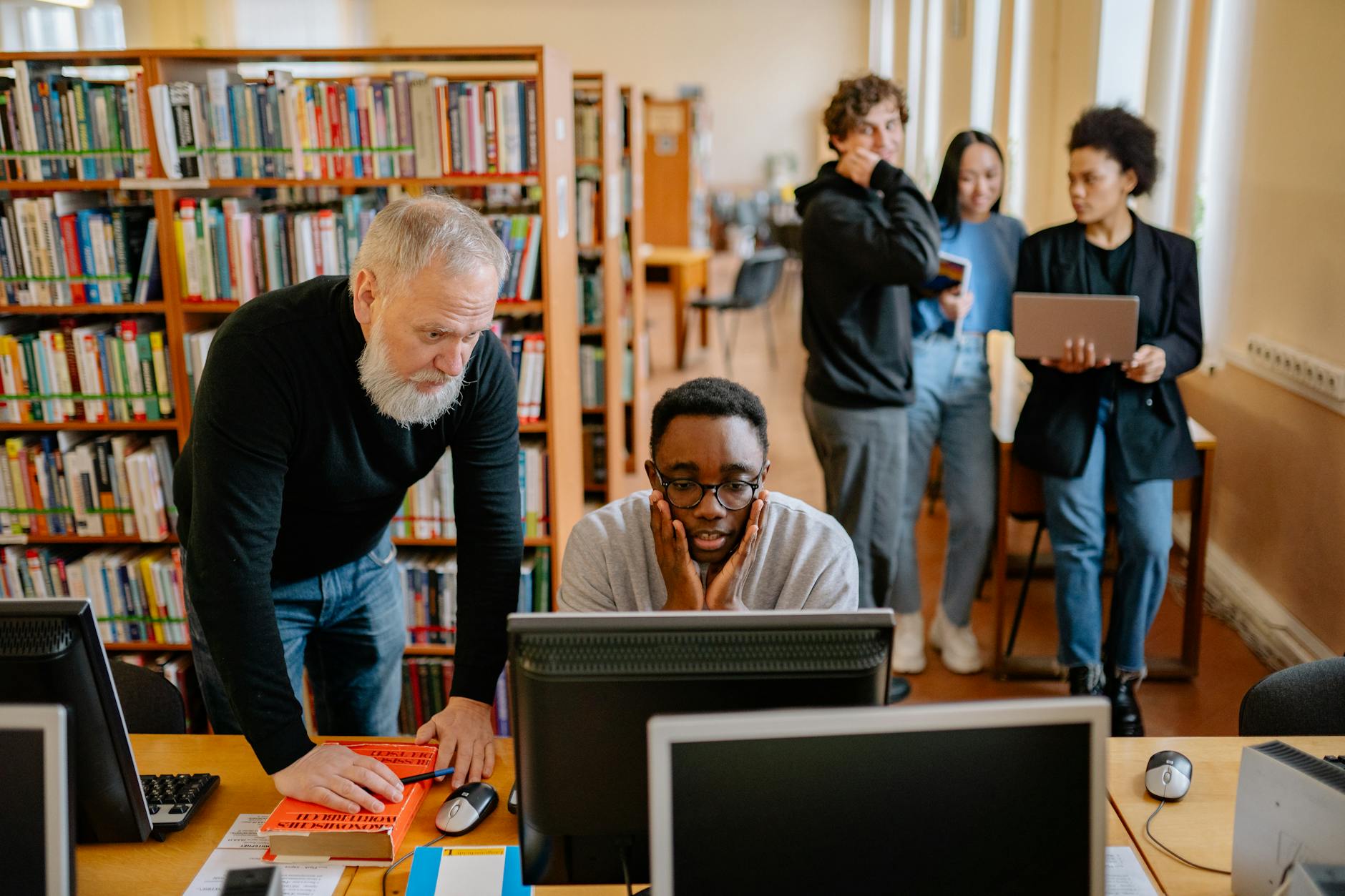 men looking at the computer monitor