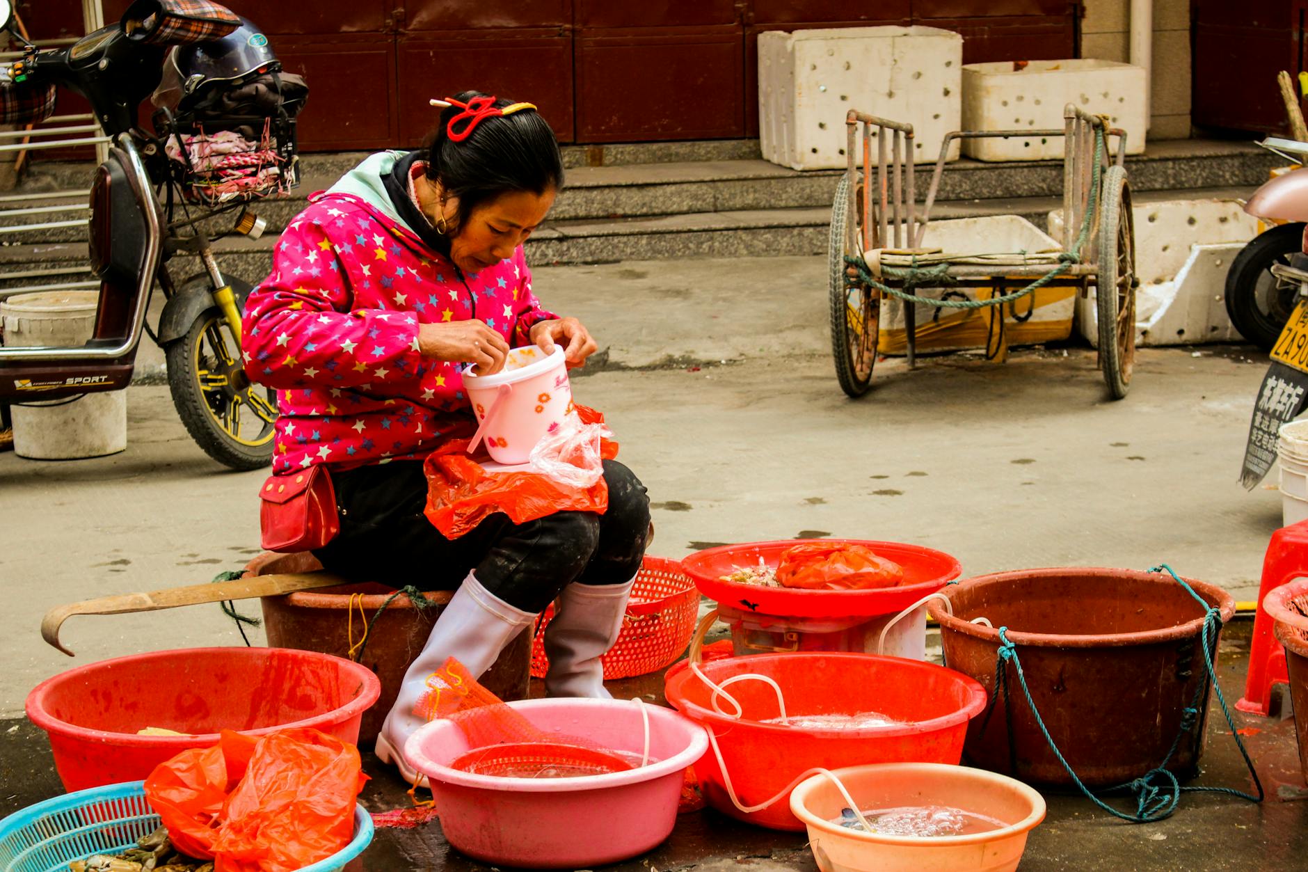 a vendor sitting on the street