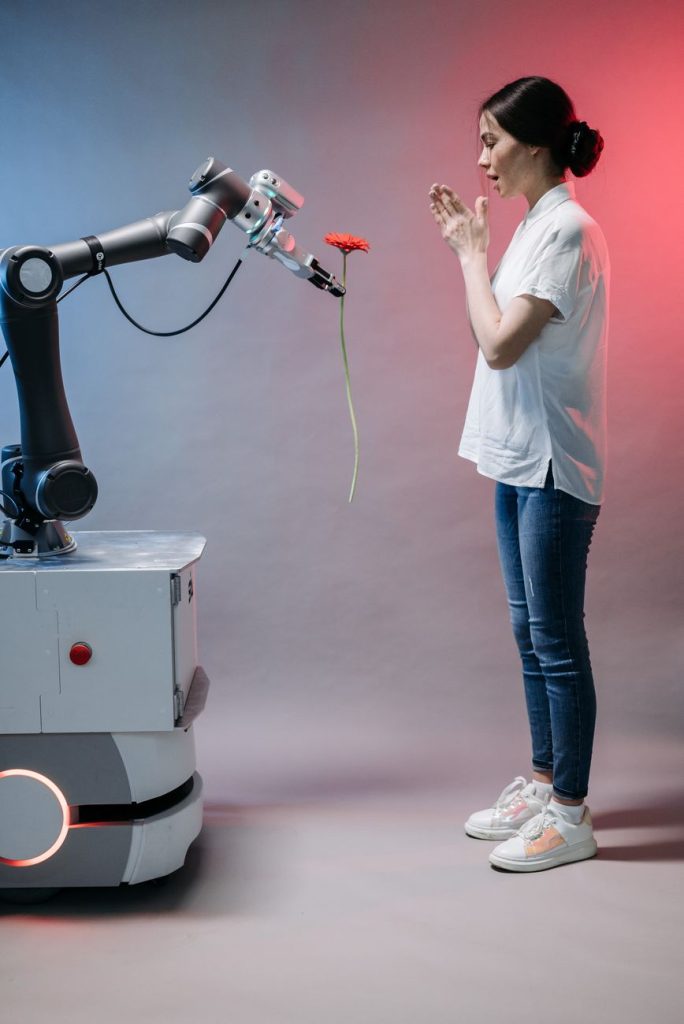 Current image: a robot holding a flower